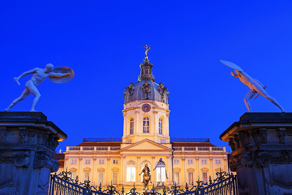 Charlottenburg Palace facade and entrance statues at night, Germany, Berlin, Charlottenburg Palace