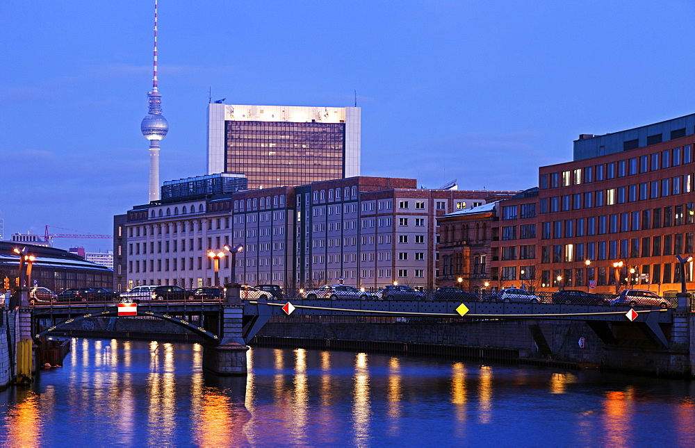 Illuminated riverfront skyline with television tower, Germany, Berlin, Berlin TV Tower, River Spree