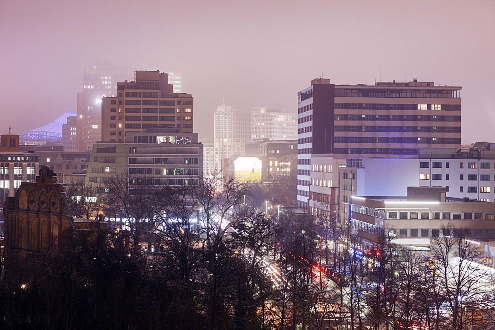 Illuminated cityscape in fog, Germany, Berlin