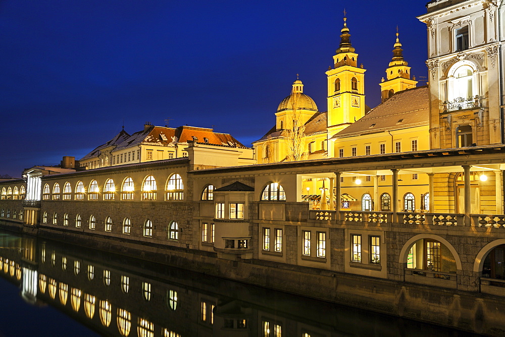 Illuminated waterfront with Saint Nicholas Cathedral, Slovenia, Ljubljana, Saint Nicholas Cathedral