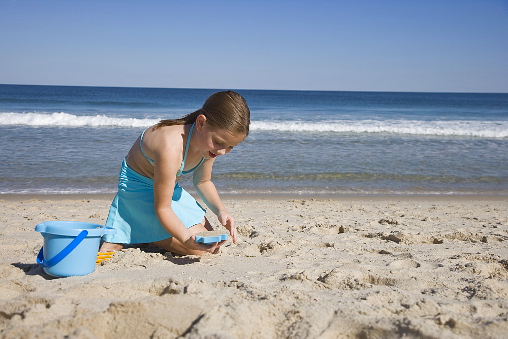 Girl playing in sand