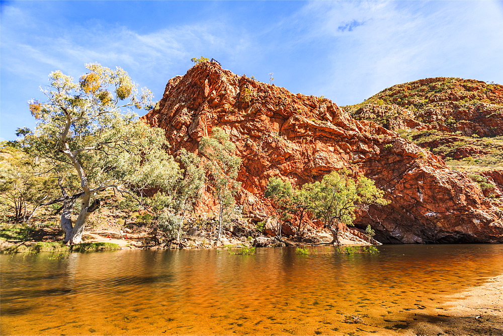 Australia, Outback, Northern Territory, Red Centre, West Macdonnel Ranges, Ormiston Gorge, Orange colored lake in red rock mountains