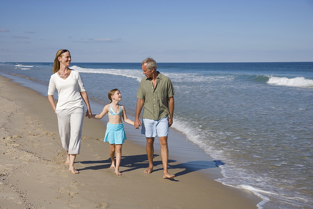 Family walking on beach