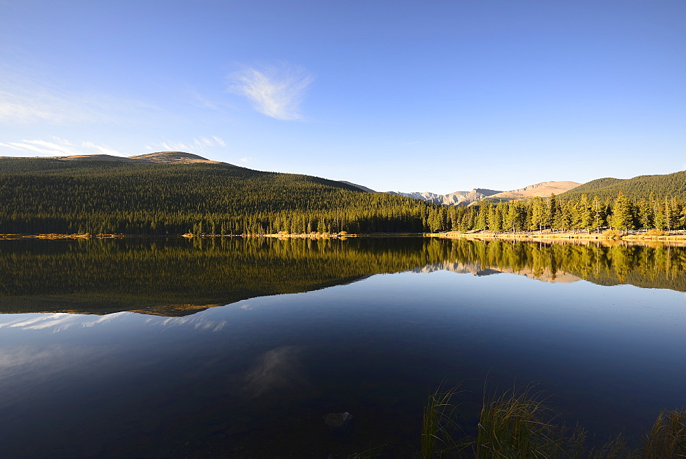 USA, Colorado, Mount Evans and forest reflecting in Echo Lake