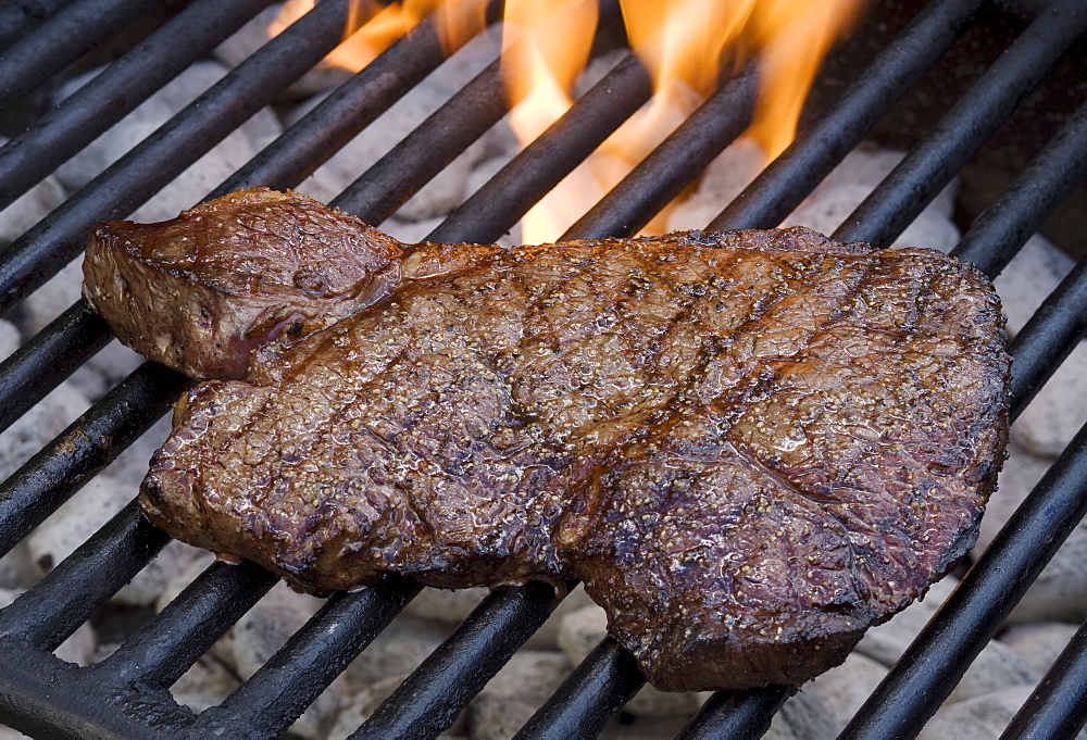 Steak cooking on grill