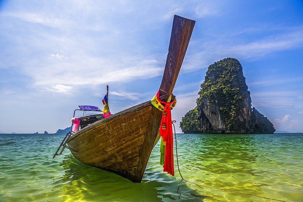 Boat by rock island in West Railay, Thailand