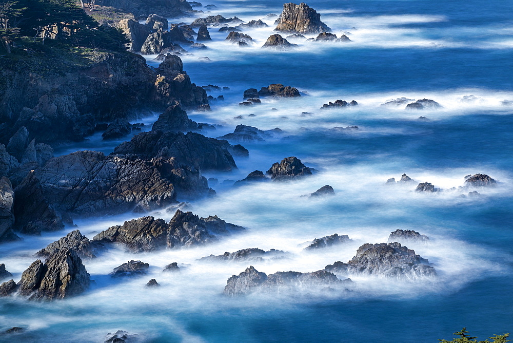 Long exposure shot of rocks in sea at Carmel-by-the-Sea, California, USA