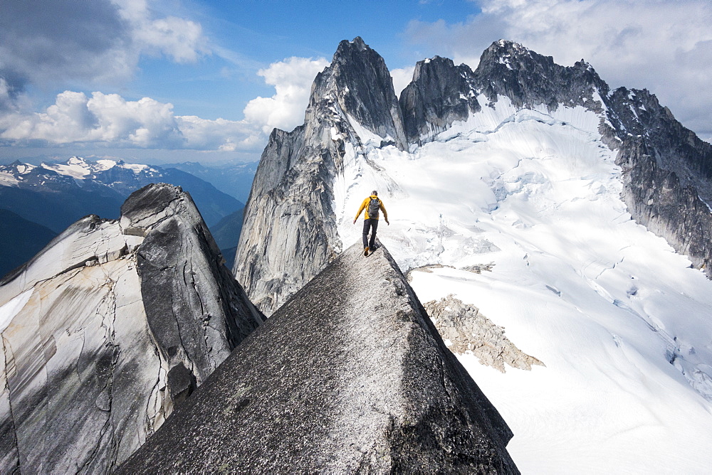 Man mountain climbing in Bugaboo Provincial Park, British Columbia, Canada