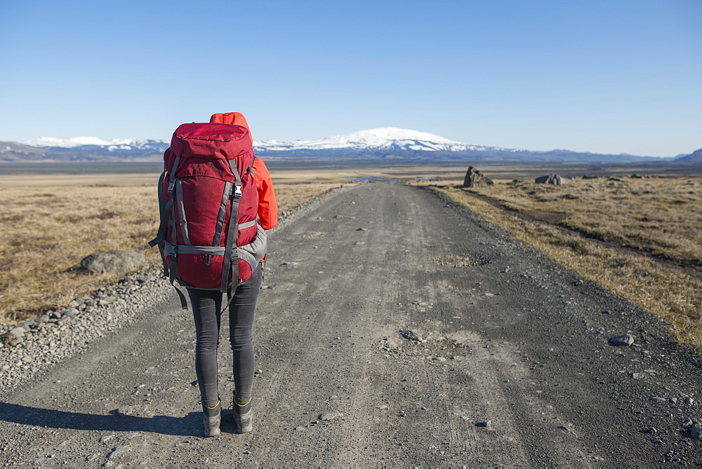 Hiker on road in Fjallabak Nature Reserve in Iceland