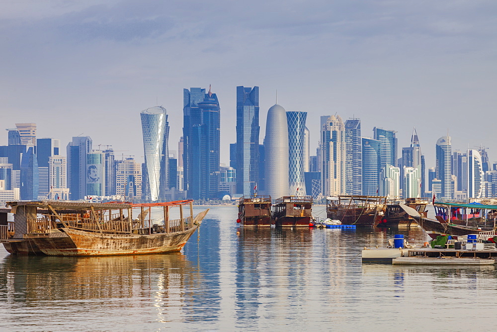 Boats by skyscraper skyline in Doha, Qatar