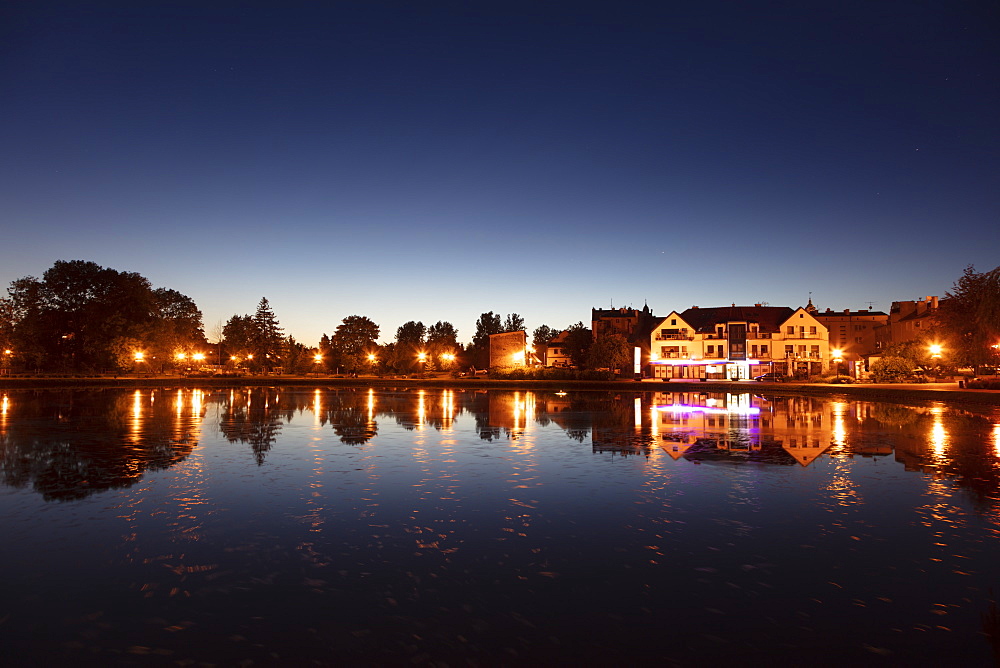 Lake and street lights at sunset in Mragowo, Warmian-Masurian, Poland