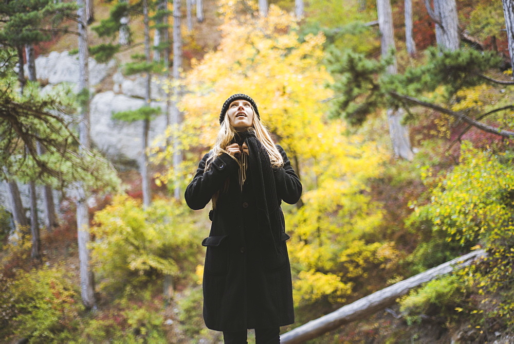 Young woman in autumn forest