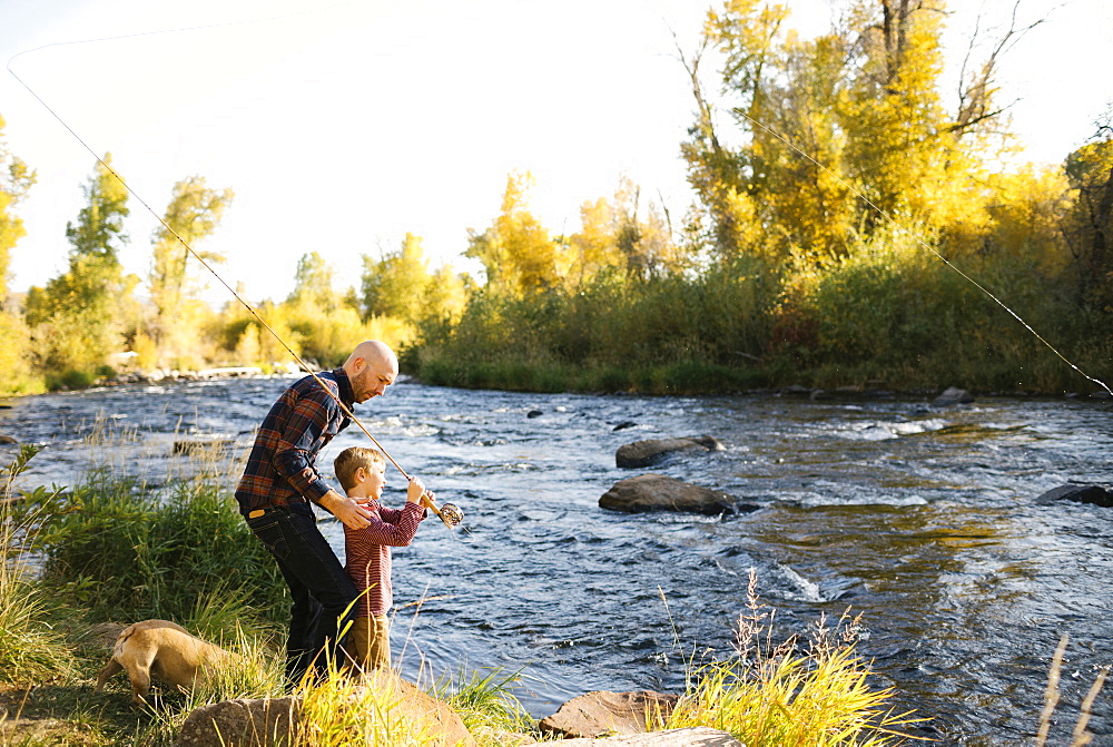 Father and son fishing together