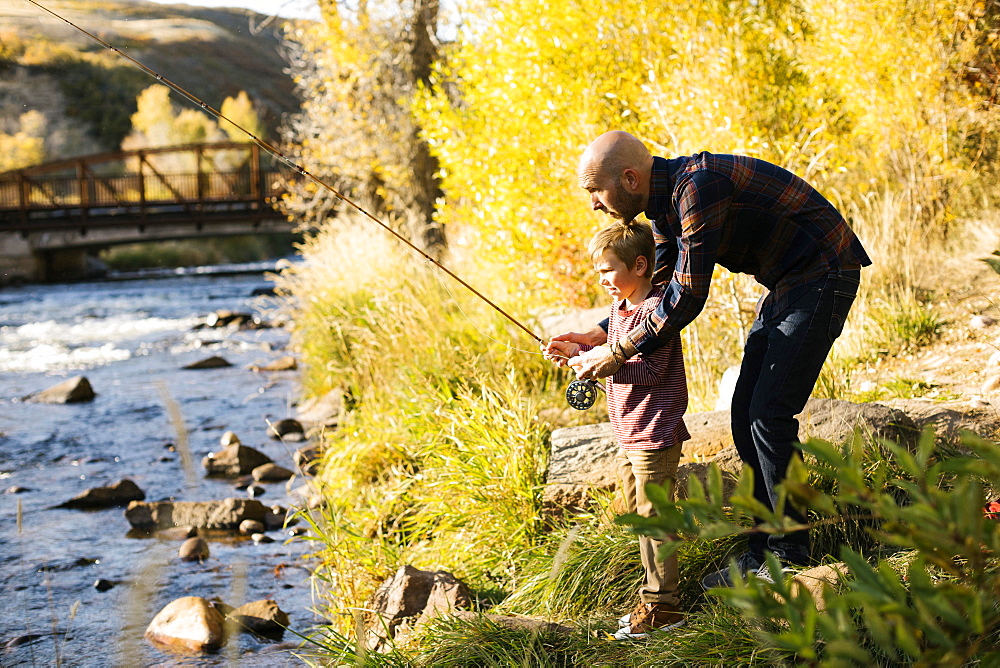 Father and son fishing together