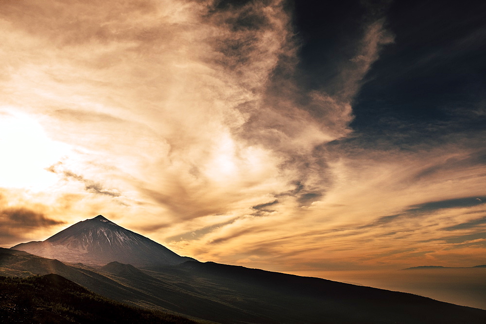 Mount Teide under clouds during sunset in Tenerife, Spain