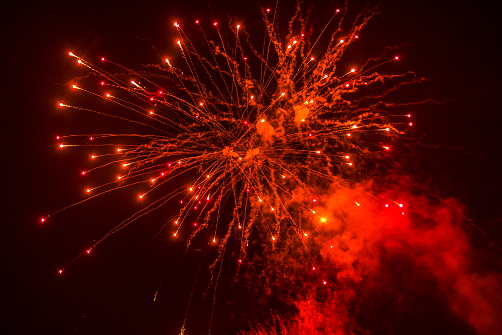 Red fireworks at night