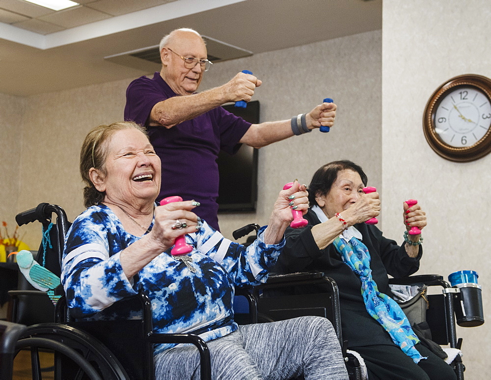 Smiling senior people exercising