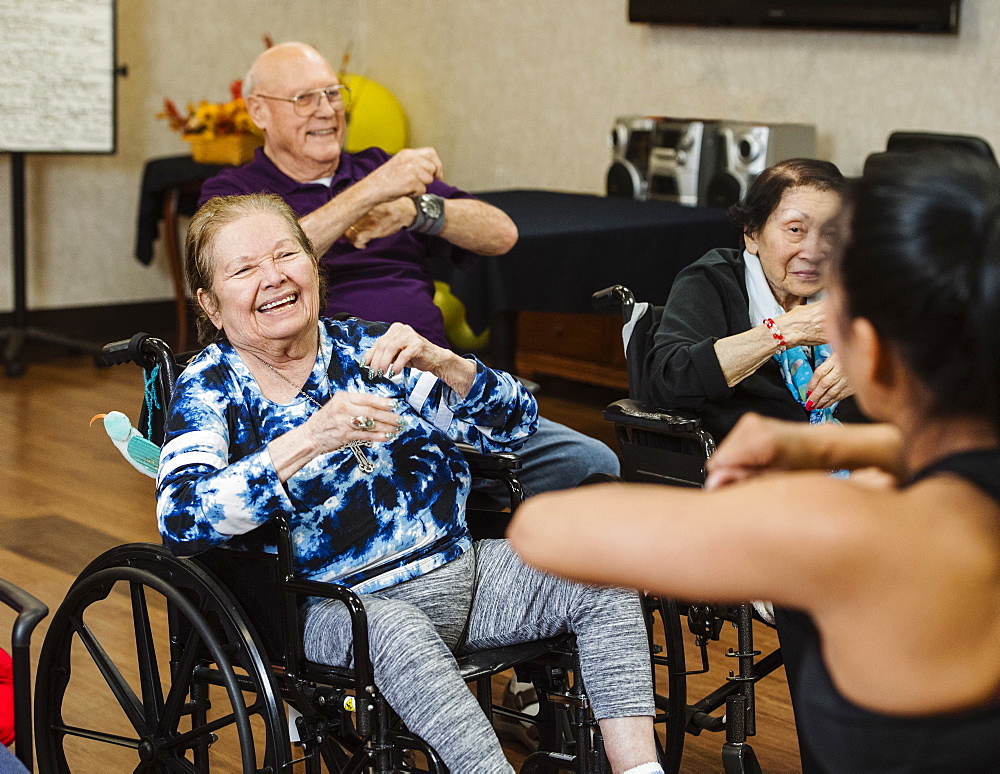 Senior people having fitness class with instructor