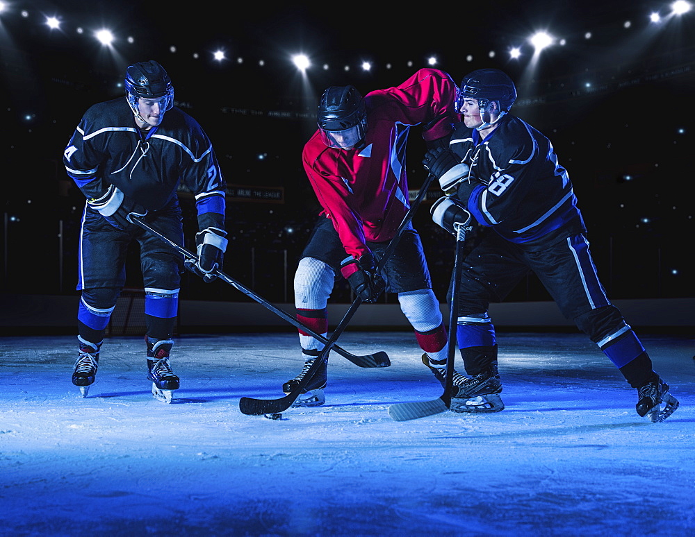 Hockey players fighting for puck