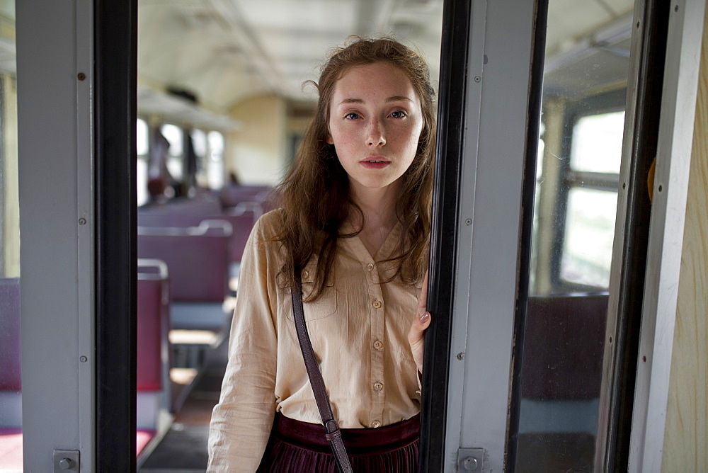 Russia, Novosibirsk, Portrait of young woman in train