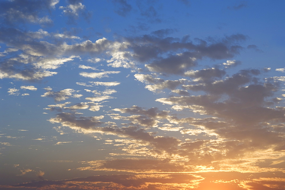 Sunset with puffy clouds