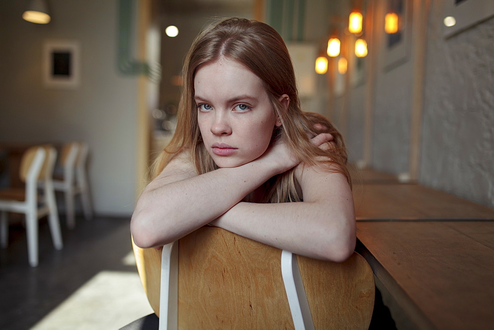 Portrait of young woman with long blond hair