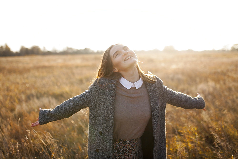 Russia, Omsk, Portrait of young woman in field