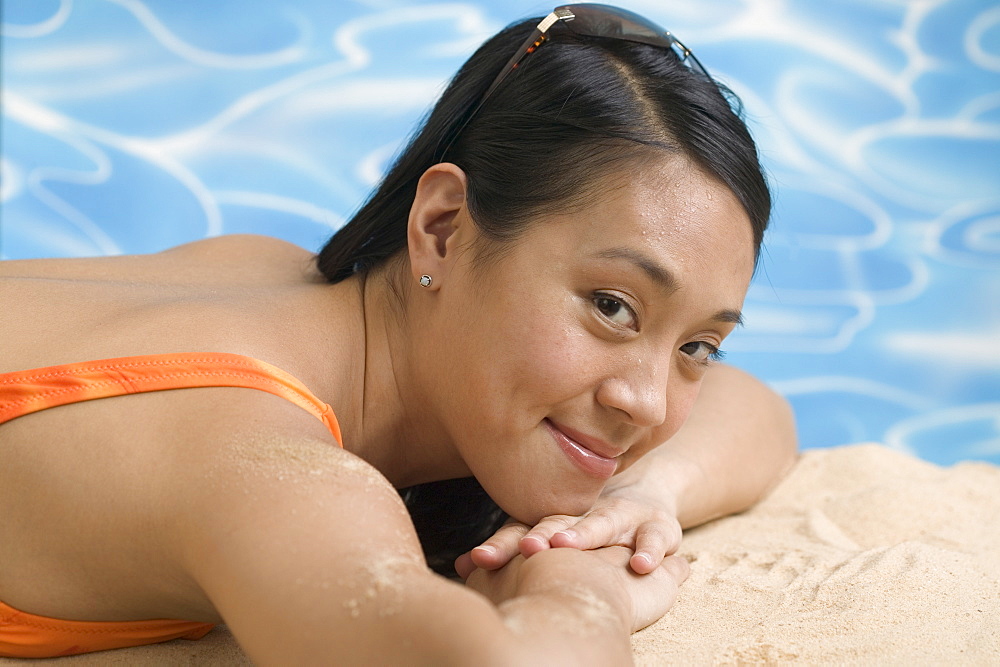 Woman reclining in swimsuit