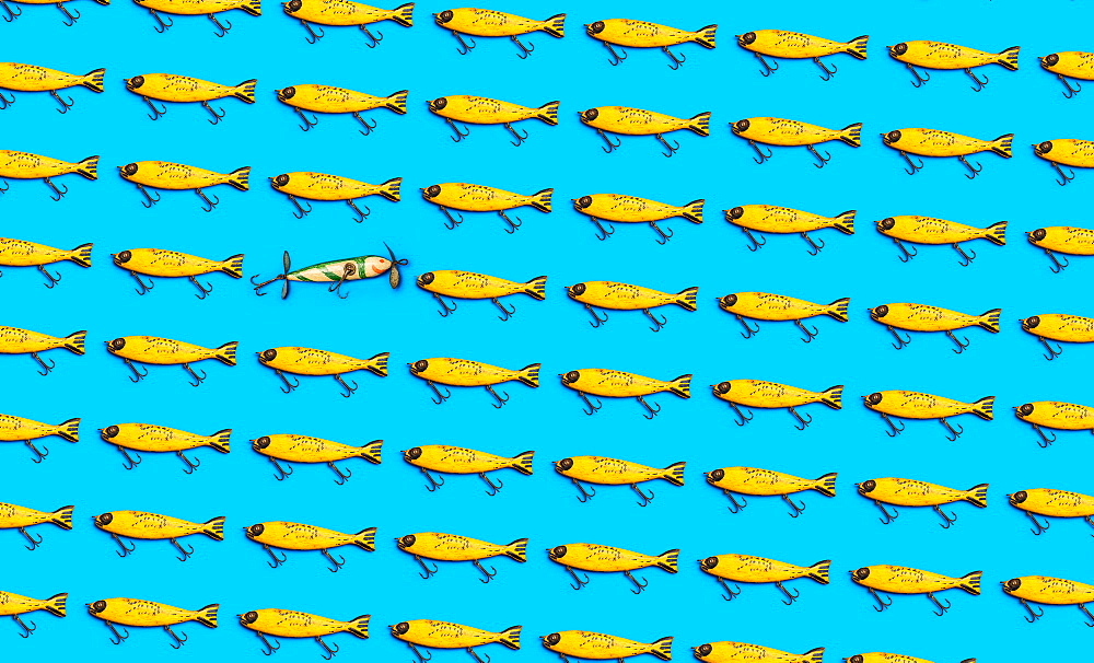 Vintage fishing lures on blue background