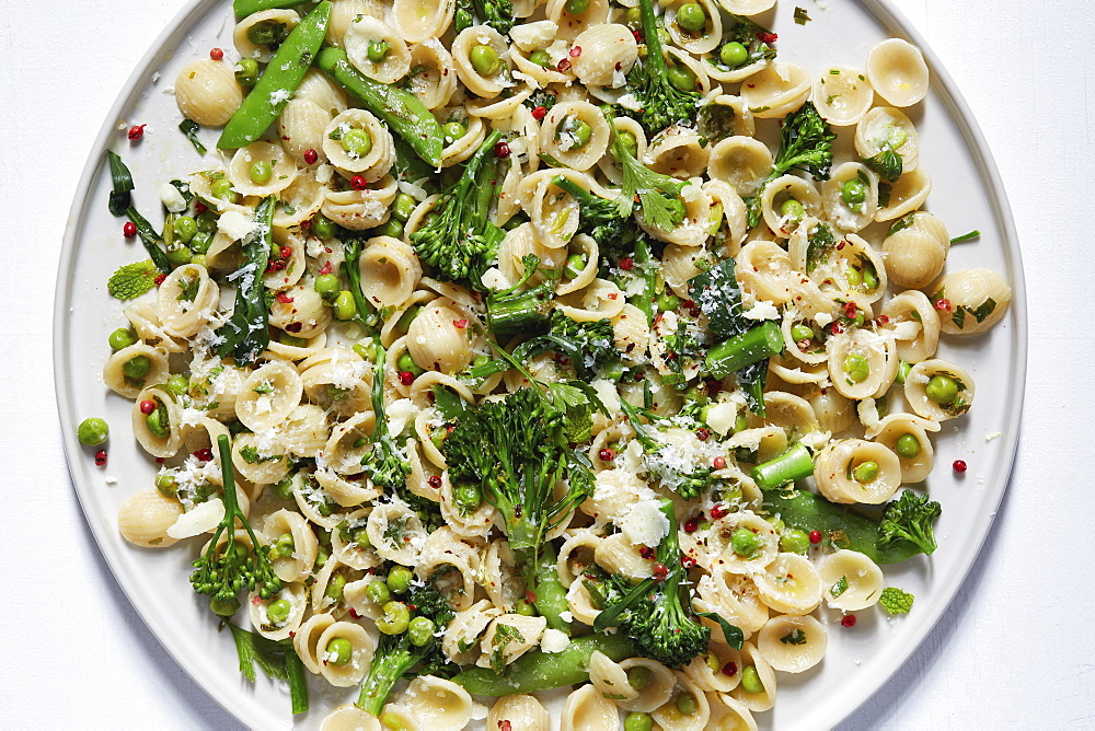 Orecchiette with broccoli and peas on plate