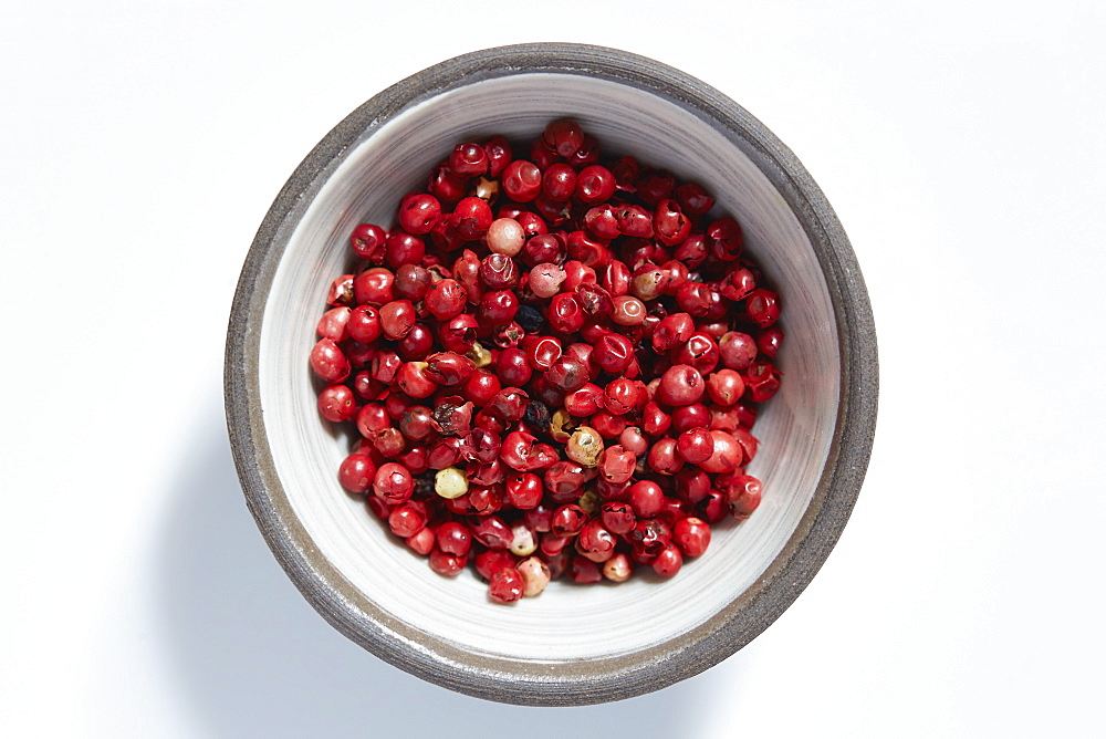 Red peppercorns in bowl