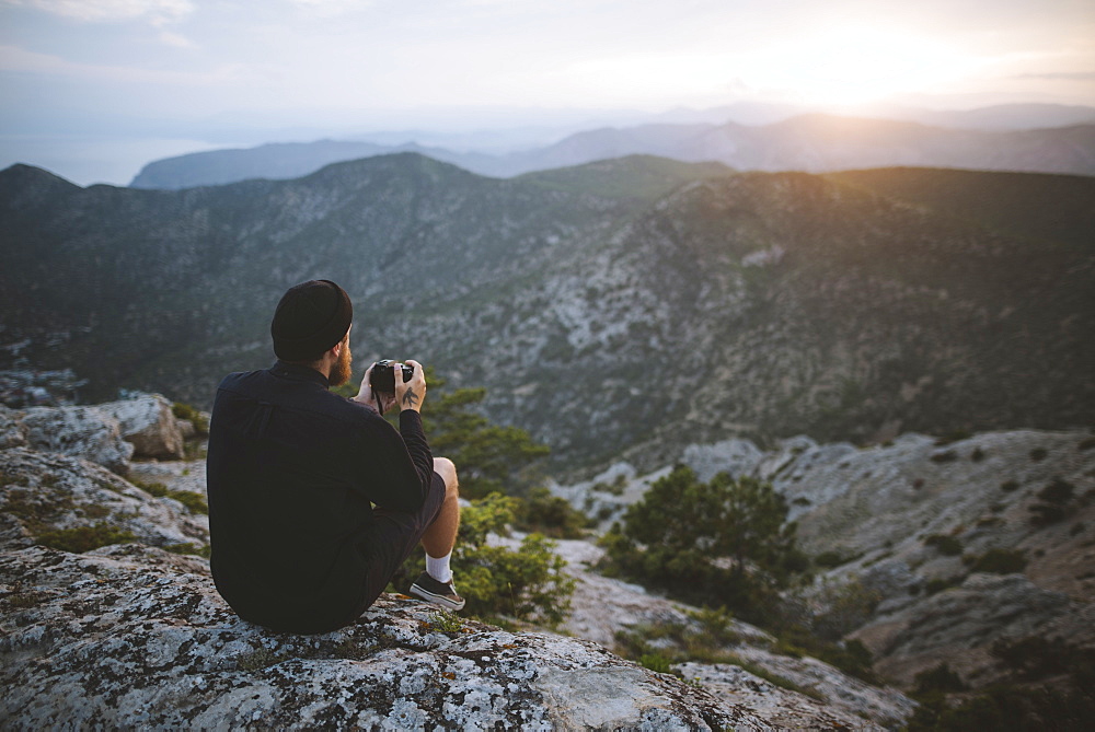 Italy, Liguria, La Spezia, Man looking at mountain range from mountain top