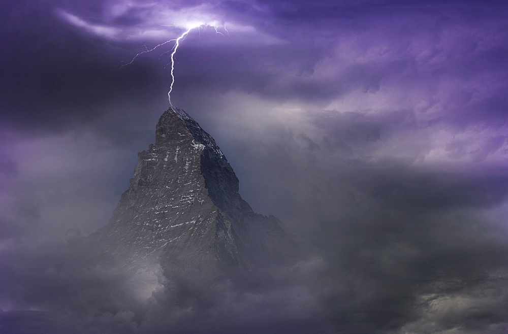 Switzerland, Canton Wallis, Zermatt, Matterhorn, Thunderstorm over Matterhorn covered with storm clouds