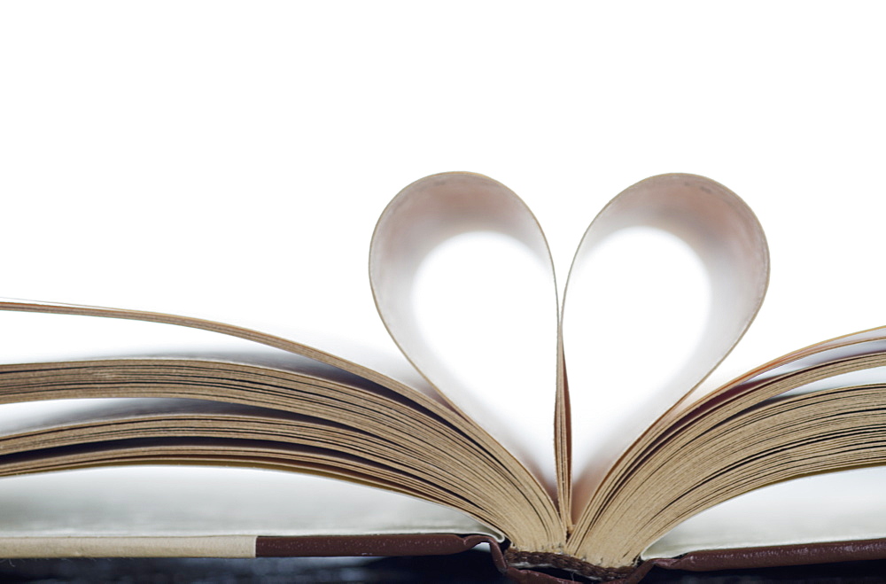 Book with pages folded in heart shape