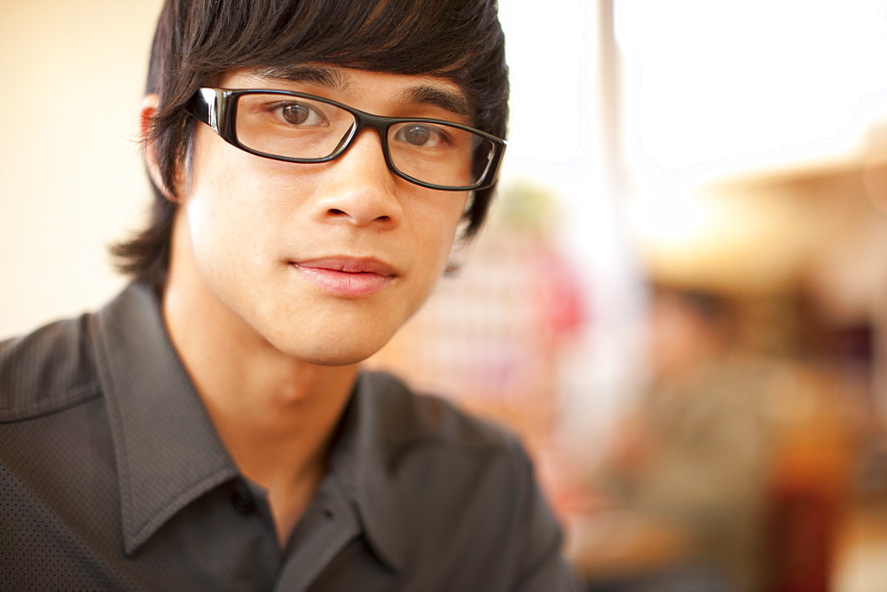 Close up of mixed race man with eyeglasses