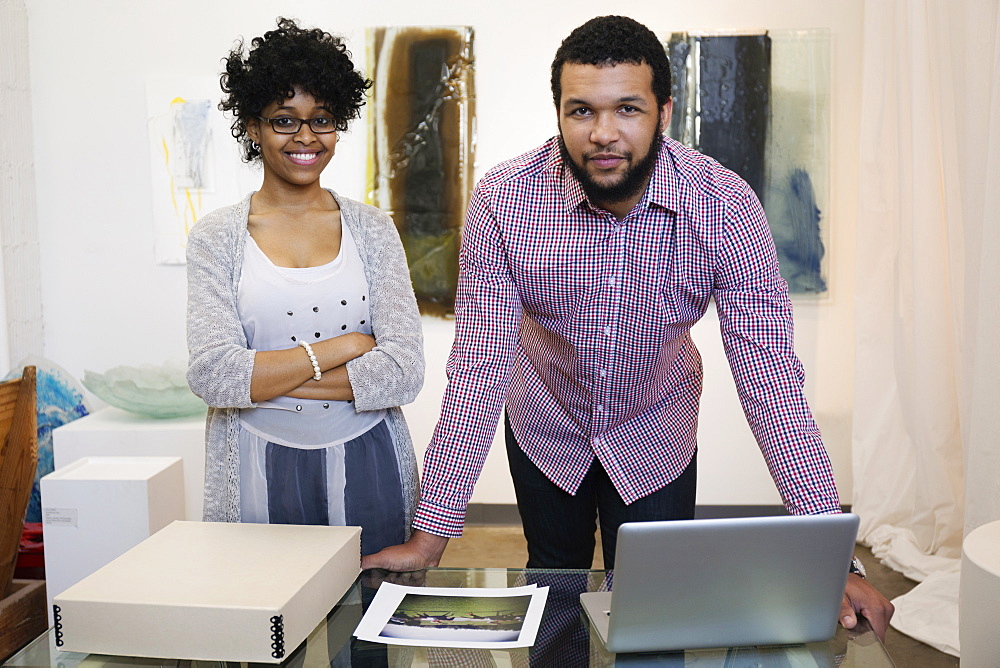 Business people working in art gallery