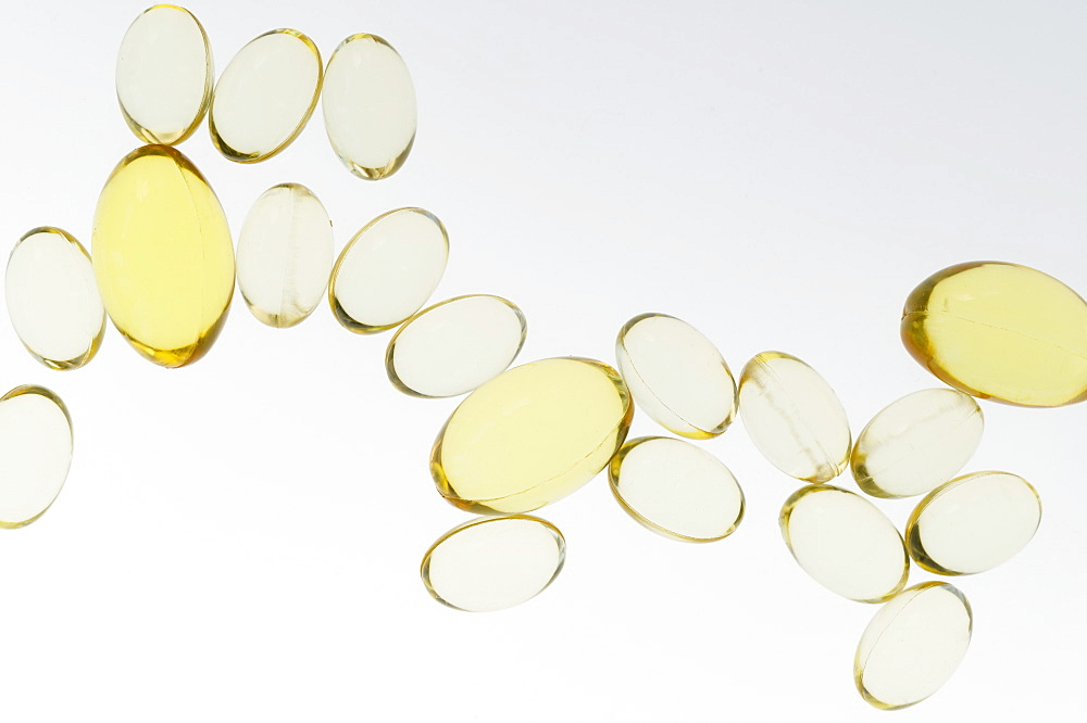 Fish oil pills on white background