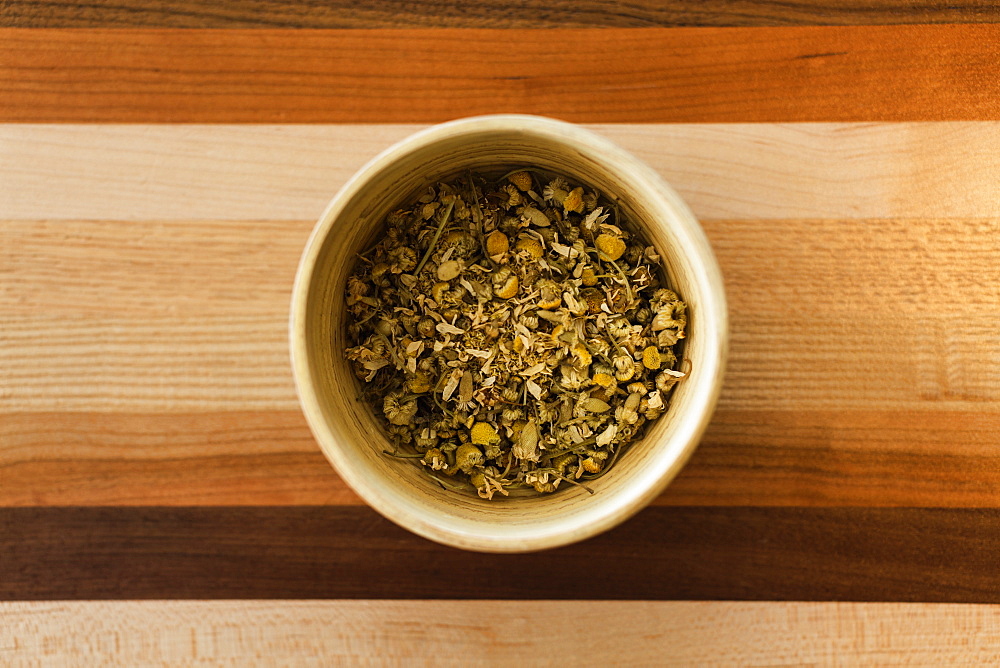 Loose leaf chamomile tea, overhead view, close-up