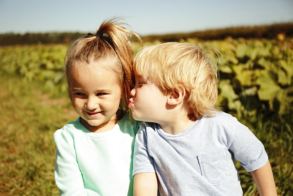 Boy kissing girl on cheek