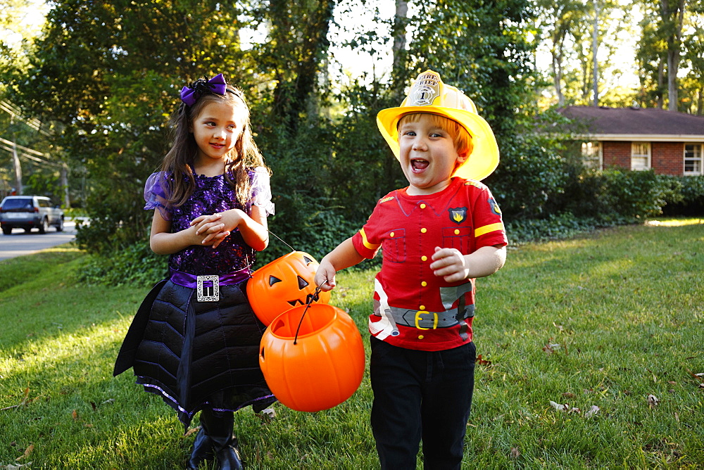 Two children trick or treating