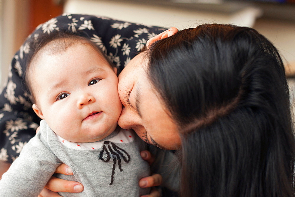 Close up portrait of mother and baby girl