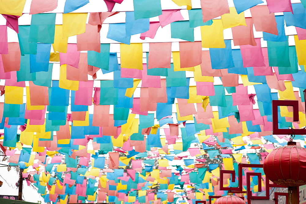 Paper flags over city street