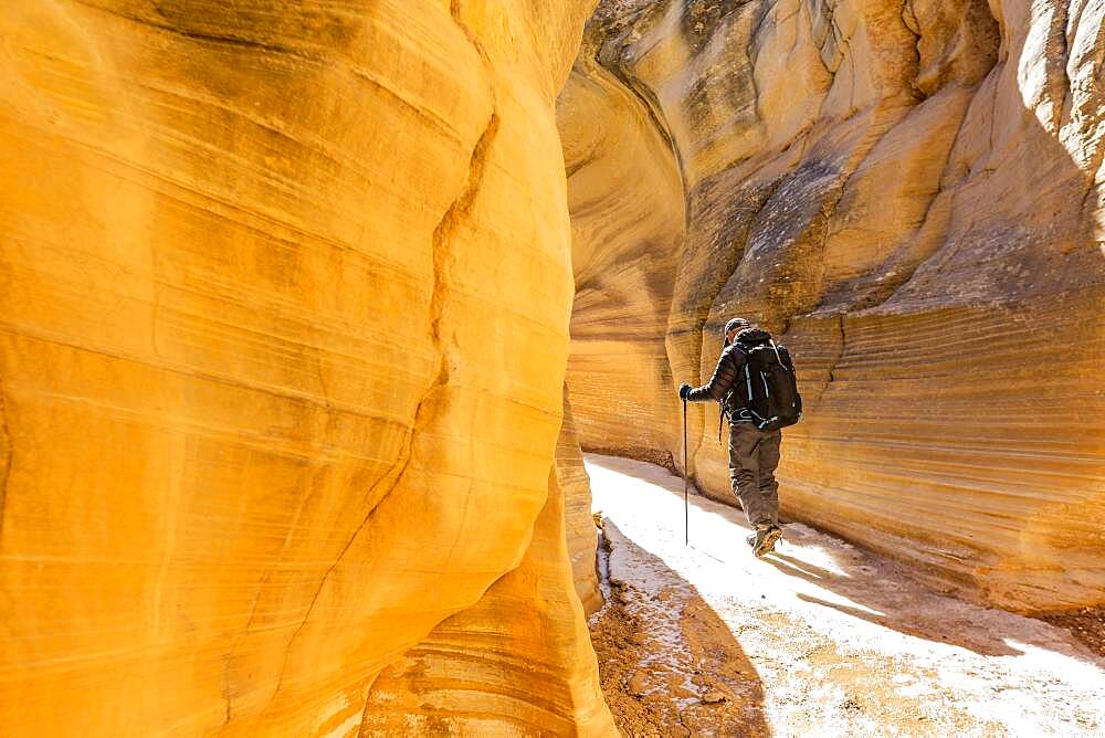 USA, Utah, Escalante, Man hiking in slot canyon in Grand Staircase-Escalante National Monument