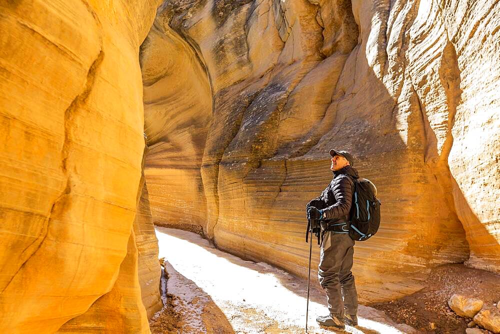 USA, Utah, Escalante, Man hiking in slot canyon in Grand Staircase-Escalante National Monument