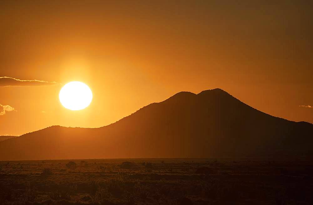 USA, New Mexico, Santa Fe, Sun setting over Cerrillos Hills State Park