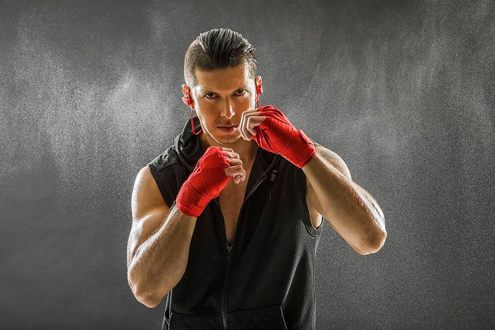 Portrait of muscular man in boxing stance