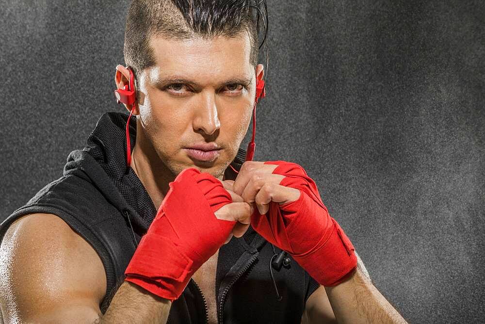 Portrait of muscular man in boxing stance