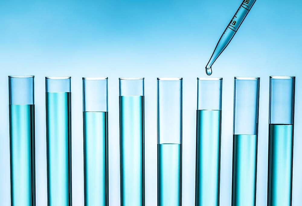 Pipette dropping liquid into test tube