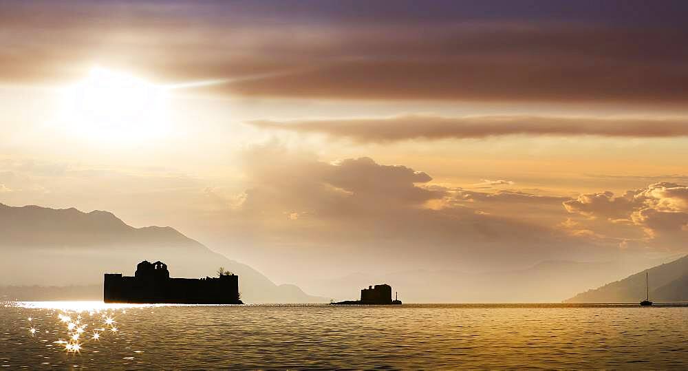 Italy, Piemonte, Lake Maggiore, Cannobio, Silhouette of Castle of Cannero on Lake Maggiore at sunset