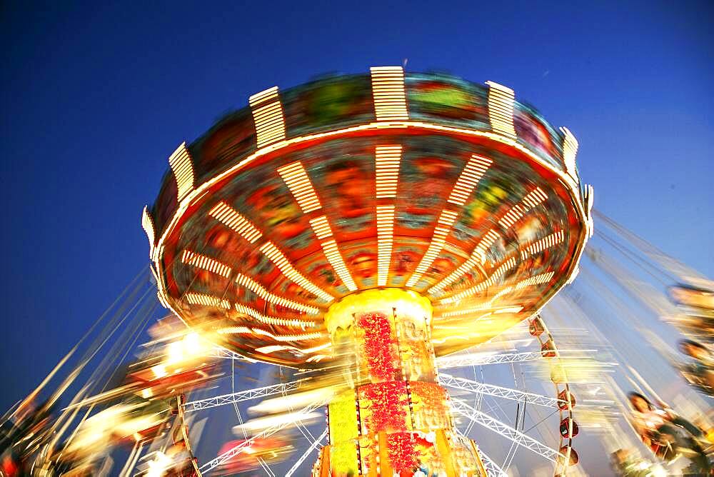 Thailand, Bangkok, Low angle view of spinning carousel